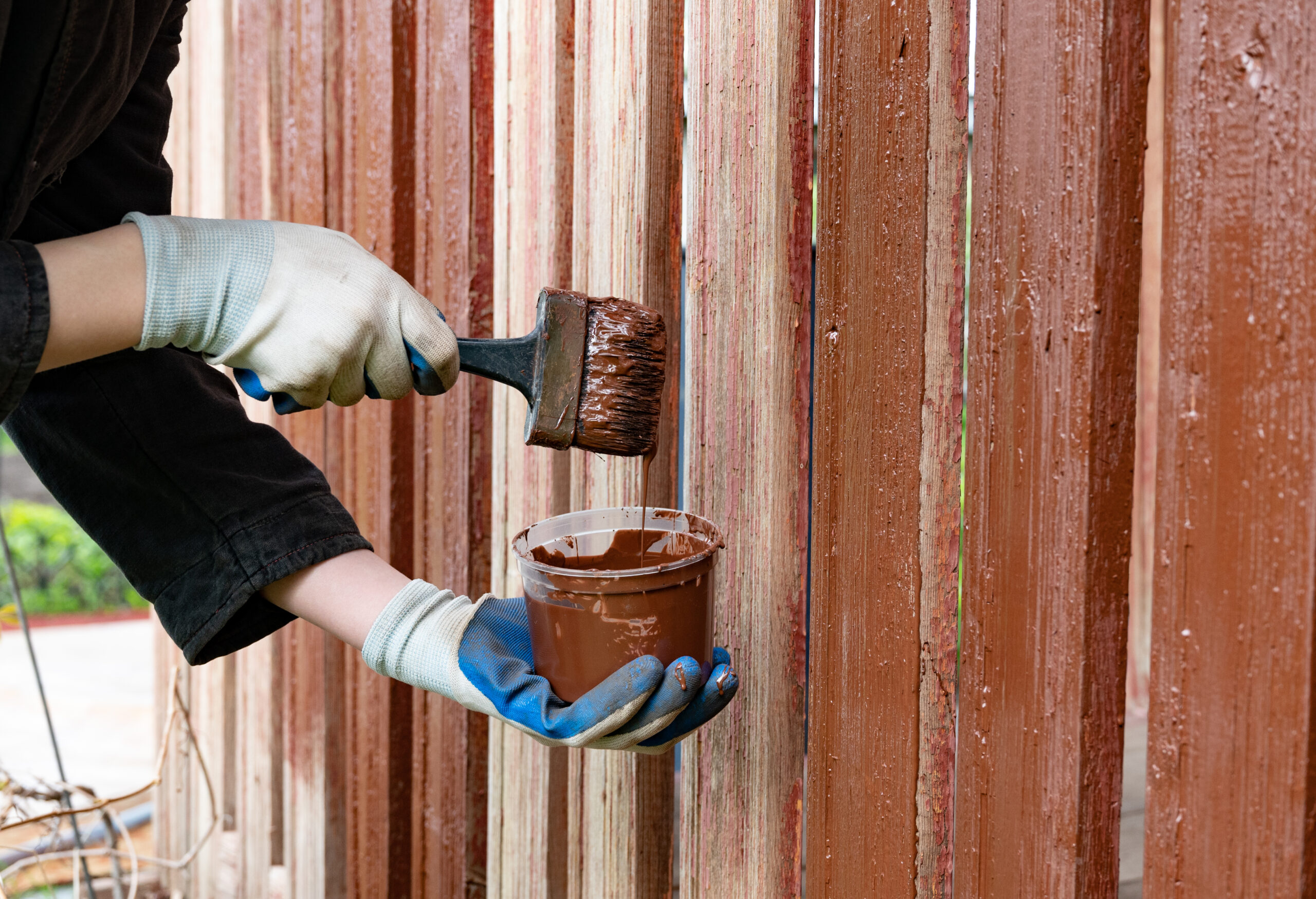 painting wooden fence with brown paint during dayt 2026 01 11 10 43 38 utc scaled
